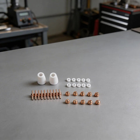 32Piece Plasma Cutter Consumable Kit with nozzles, electrodes, ceramic rings arranged on a workshop table for PT31 LGK40 CUT40 CUT50 CT312 CT418 CT520 SUPER200P.