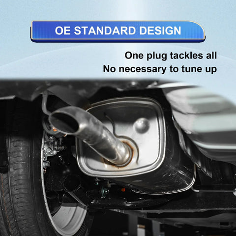 Automotive exhaust muffler with tailpipe visible undercarriage beside wheel; silver metal.