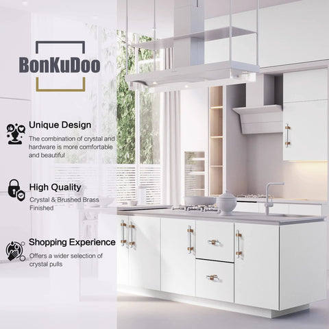 Modern kitchen with white cabinets featuring crystal glass drawer pulls in champagne bronze finish set of five cabinet handles.