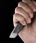 Person holding Dope Multitool Pry Bar Bottle Opener For Camping And Outdoors, showcasing metal pry bar design.