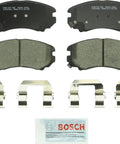 Bosch BC924 QuietCast ceramic front brake pad set with mounting hardware and lubricant packet; four pads