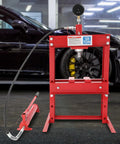 Heavy Duty Hydraulic Benchtop Shop Press With Three Gear Adjustable Height Pressure Gauge Hydraulic Pump H Frame Design For Car Repair Garage Projects And Light Automotive Work, shown in a workshop setting with a car in the background.