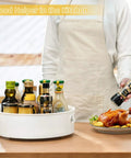 Person using 360 Degree Rotating Lazy Susan Turntables Two Size Pack 9 Inch And 12 Inch for organizing kitchen spices.