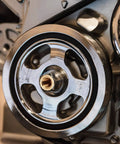 Close-up view of a metal pulley system with polished components