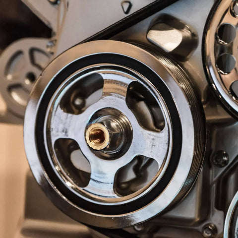Close-up view of a metal pulley system with polished components