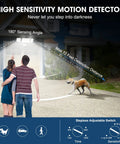Couple with LED Security Lights With Motion Sensor Outdoor Flood Light 32W, 3200 Lumens on driveway, dog detected