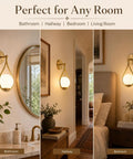 Lit Mid Century Modern Wall Sconces Set Of 2 with globe glass shades in antique brass finish shown in bathroom, hallway, bedroom