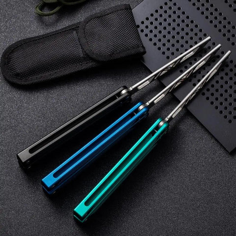 Three folding knives with T6061 channel handles in black, blue, and green, showcasing Integrated Forging Bushing System Flip Knife design.