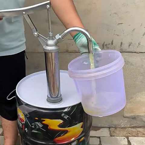Heavy Duty Manual Oil Drum Pump With Ergonomic Handle For High Pressure Transfer And Effortless Sump Cleaning in use, pouring oil into a bucket.
