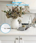 300 Pack Clear Cabinet Bumpers Self Adhesive Rubber Stopper Pads on a kitchen counter with flowers, avoiding scratches.