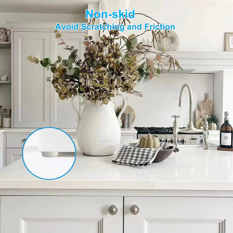300 Pack Clear Cabinet Bumpers Self Adhesive Rubber Stopper Pads on a kitchen counter with flowers, avoiding scratches.