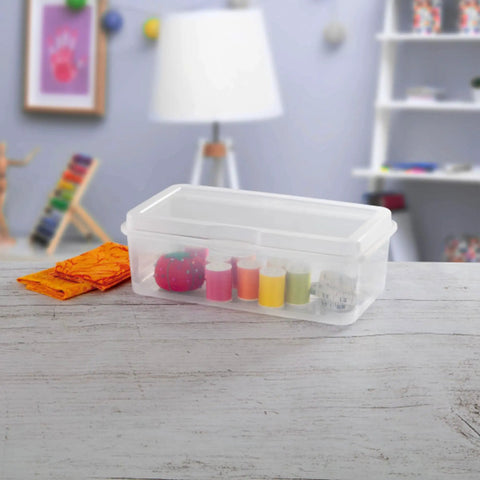 Six Pack Large Clear Plastic Storage Box With Hinged Lid, Stackable Multipurpose Organizer on a desk with art supplies