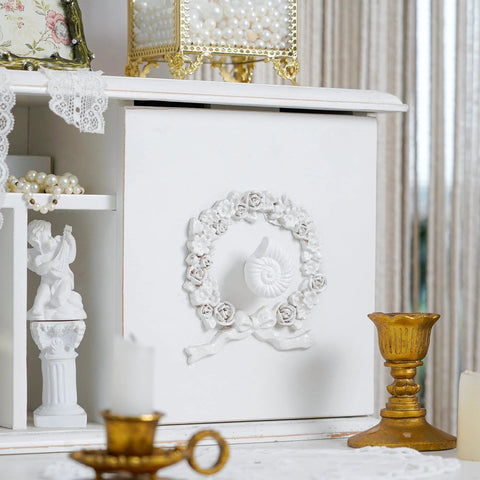 Vintage cabinet with Six Pack Resin Beach Conch Cabinet Knobs In Antique White Finish, coastal decor setup with gold accents.