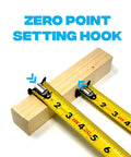 Rugged 25 Ft Tape Measure With Nylon Coated 1.25 Inch Blade, Dual Magnet Hook, Shockproof ABS Housing, Stands Out Up To 13 Ft on wood block