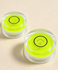 5Pcs Small Circular Bubble Levels with Double Sided Adhesive, mini green levels in clear casing, 15mm diameter, two pieces shown.