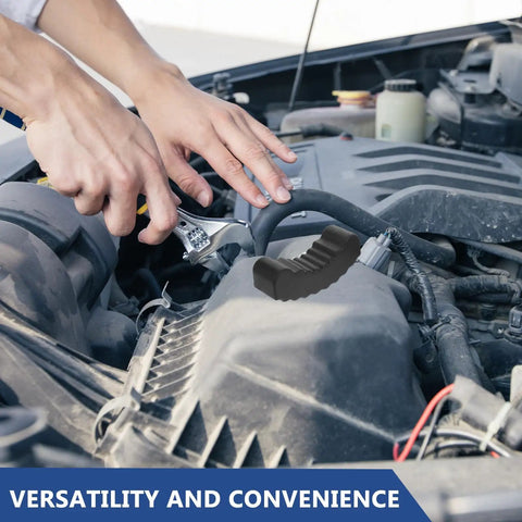 Mechanic using a wrench near a car engine with a 2 Pack 6 Ton Jack Stand Rubber Pads Anti Slip Floor Jack Grip Pads With Slotted Lift Buffer visible.