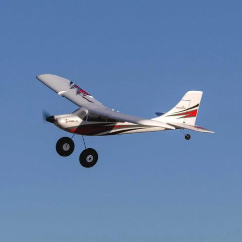 RC Airplane Apprentice STOL S 700 RTF with AS3X SAFE Technology in flight against a blue sky.