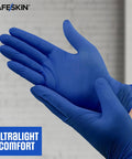Safeskin blue nitrile disposable gloves on hands; close-up, large size, 2.0 mil, powder-free, latex-free