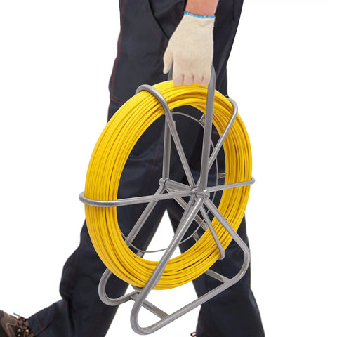 Person carrying Fiberglass Fish Tape 6Mm 425ft Duct Rodder Cable Puller for Electrical Wiring with steel wheel stand.