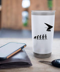 White hang glider themed stainless steel insulated tumbler with evolution graphic, 20 oz, on a table with phone and keys.