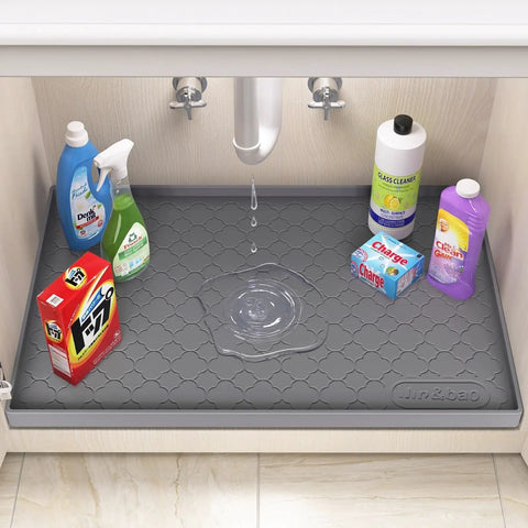 Under Sink Waterproof Silicone Cabinet Mat 34 Inch by 22 Inch, Thick Edge Protector for Kitchen and Bathroom with cleaning supplies