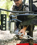 Person adjusting Weight Distribution Hitch With Tension Chain System For Easy Hitching And Anti Bounce Sway Control