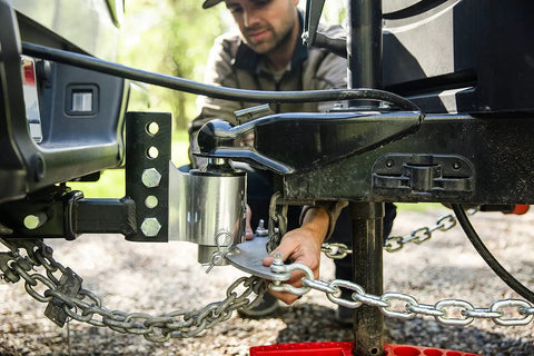 Person adjusting Weight Distribution Hitch With Tension Chain System For Easy Hitching And Anti Bounce Sway Control