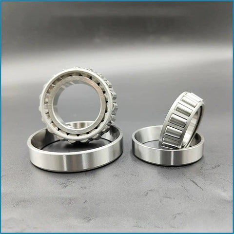 Badass Stainless Steel Tapered Roller Bearings S32014 70mm By 110mm By 25mm in multiple angles on a gray background.