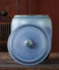 Slick Ceramic Food Storage Jar Gradient Blue Rice Cylinder High Temperature Fired Pantry Bin with lid on a wooden surface.