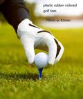 Gloved hand places golf ball on Rubber Cushion Top Golf Tees, 50 Pack Unbreakable Plastic Rubber Tees In Mixed Colors, 3.25 inches