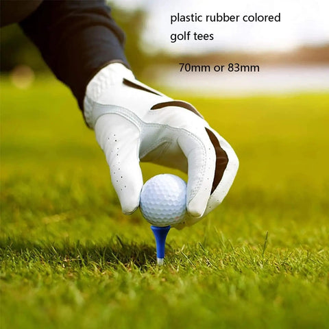 Gloved hand places golf ball on Rubber Cushion Top Golf Tees, 50 Pack Unbreakable Plastic Rubber Tees In Mixed Colors, 3.25 inches