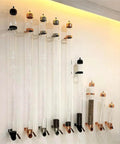 Wall Mounted Coffee Bean Dispenser With Clear Glass Canister And Smooth Wooden Lever For Mess Free Serving Keeps Countertops Clutter Free And Saves Serious Space For Your Daily Beans on a wall.