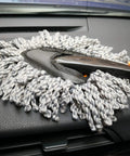 Using Six Pack Car Detailing Kit With Scratch Free Interior Duster on car dashboard