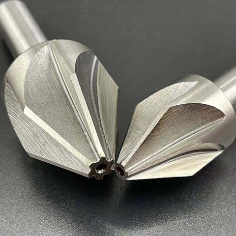 Close-up of two carbide chamfer end mills (60° V-bit), 16mm diameter, multi-flute CNC deburring tools