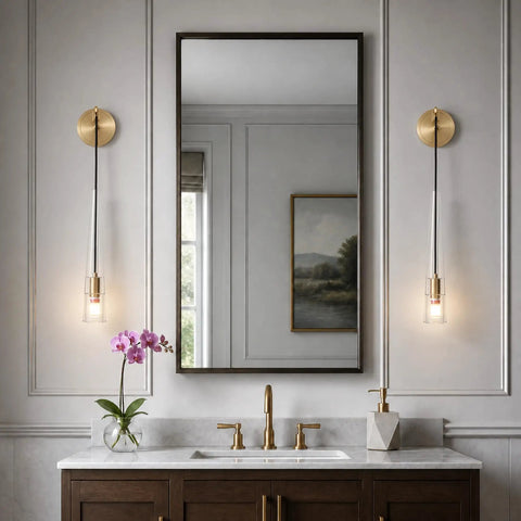 XYDikssn Crystal Wall Sconces, Brushed Gold Brass Wall Lights with Clear Crystal Glass beside mirror in elegant bathroom setting.
