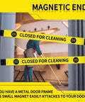 Heavy Duty Nylon Door Barricade Signs Set Of Four Hella Visible Warning Strips With Super Tight Magnetic Clamps in use while cleaning.