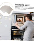 Man installing Mica Sheet Microwave Waveguide Cover Kit 12 Piece Heat Resistant Insulation Plate in microwave oven