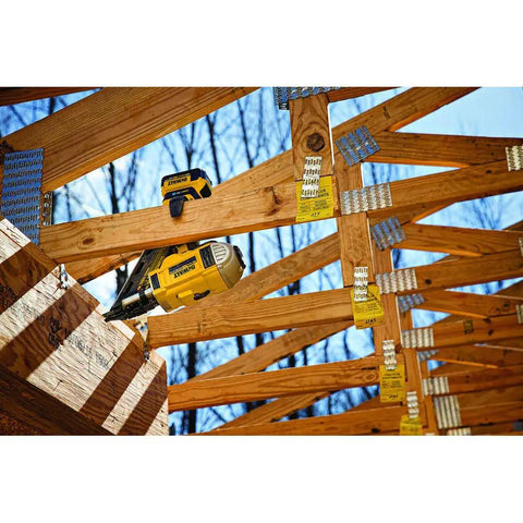 Tool Connect 20V Max Connector for Last Seen Location and Quick Jobsite Assignment on power tool in wooden framing