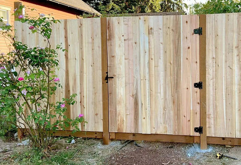 Wooden fence with heavy duty 3-1/2 inch T hinge gate hinges steel with black finish includes screws 6 pack for outdoor use.