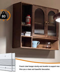 Heavy Duty Aluminum French Cleat Picture And Mirror Hanger Kit 12 Inch mounted rail holding a wooden cabinet with contents.