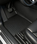 Driver's side view of Tesla Model Y Juniper All Weather Floor Mats And Cargo Liners 9 Piece CabinProtect Pro Kit Full Cabin Protection System Only Fits Premium And Performance For Daily Rugged Use