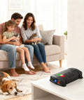 Family in living room with Dual Ultrasonic And LED Strobe Rodent Deterrent For Cars And Indoor Use on table, pet-friendly solution
