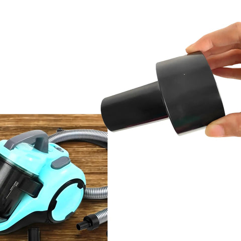 Vacuum Hose Adapter Two And A Half Inch To One And A Quarter Inch For Shop Vacuums Wet And Dry Black held near a vacuum cleaner