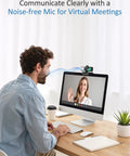 Man using Crisp 4K Webcam For Pc Or Laptop With Killer Noise Cancelling Mic, Easy Plug Play Usb Setup for video calls.