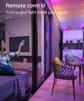 Outdoor LED Strip Lights Waterproof 100 Ft 6 Rolls Of 16Ft 4In IP65 Ultra Long RGB 5050 in a living room with remote control