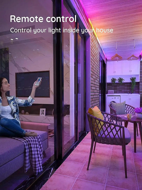 Outdoor LED Strip Lights Waterproof 100 Ft 6 Rolls Of 16Ft 4In IP65 Ultra Long RGB 5050 in a living room with remote control