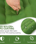 Close-up of green 5 Inch Thick Camping Sleeping Pad With Built In Pillow And Foot Pump material highlighting durability.