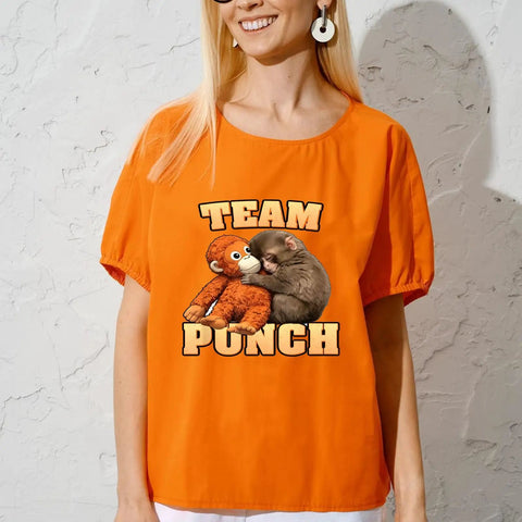 Person wearing orange shirt with 'Team Punch' ape and kitten graphic