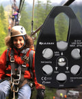 30kN Beefy Rescue Pulley Sheave With Swing Plate CE UIAA Certified shown in use on a zipline with a child wearing safety gear.