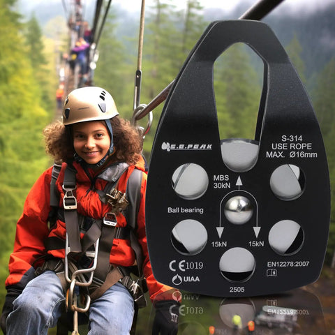 30kN Beefy Rescue Pulley Sheave With Swing Plate CE UIAA Certified shown in use on a zipline with a child wearing safety gear.